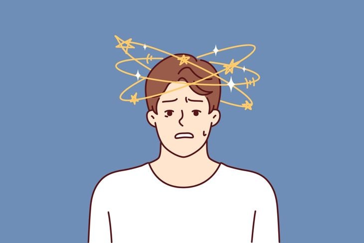 Man with dizziness and stars flying around head