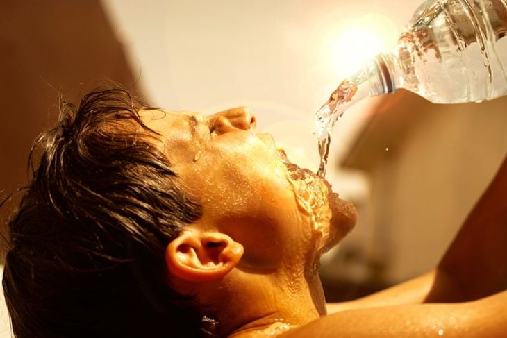 People suffering heat wave day in summer under direct sunlight