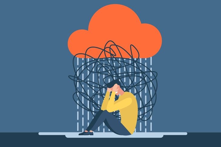 Man with anxiety touch head surrounded by think
