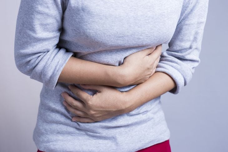 Woman experiencing stomach pain