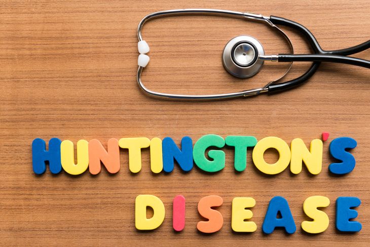 huntington's disease  colorful word with stethoscope on wooden background