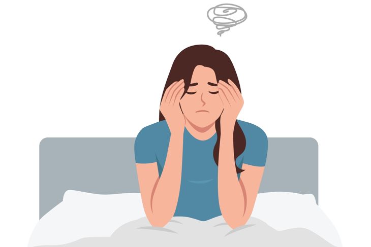 young woman staying in bed in her bedroom