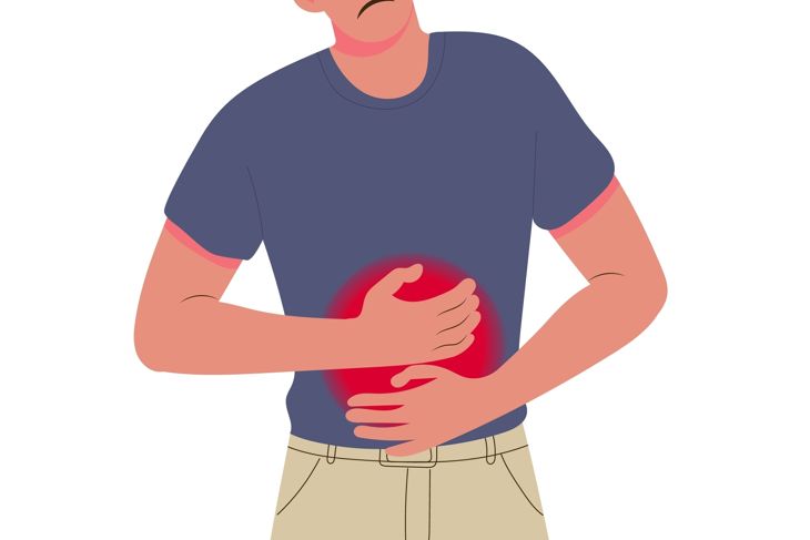 Man holds his stomach with both hands