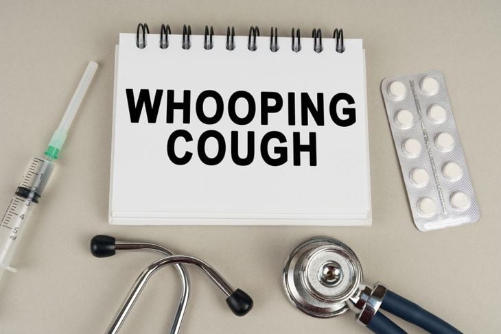  a stethoscope, a blister and a notepad with the inscription - Whooping