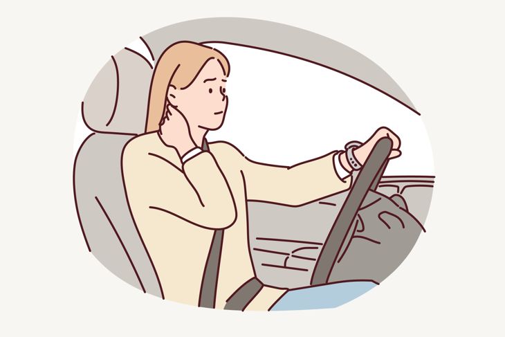 woman with pain at her neck after driving