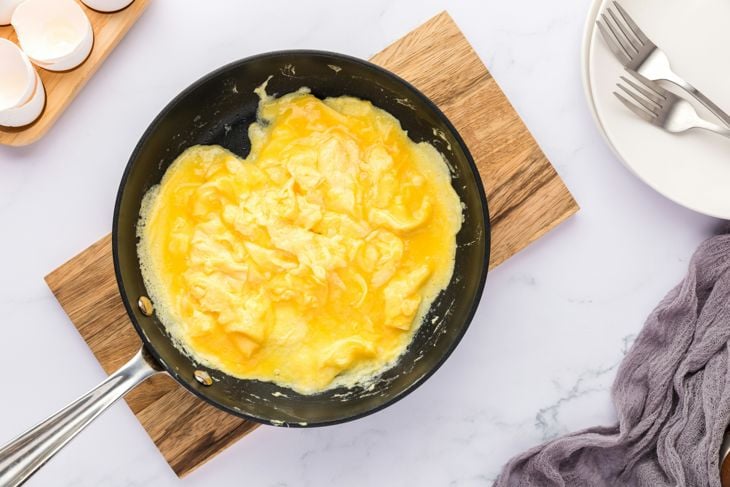 A pan filled with eggs on top of a table photo