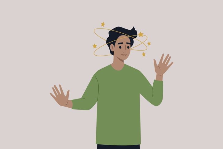 A young male character feeling dizzy with yellow stars orbiting around their head