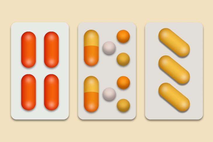set of pills for pain relief in gray blisters