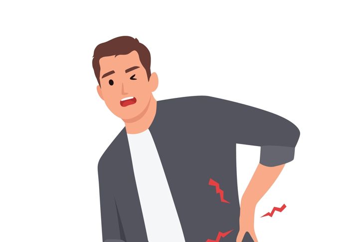 Young man suffering from back pain