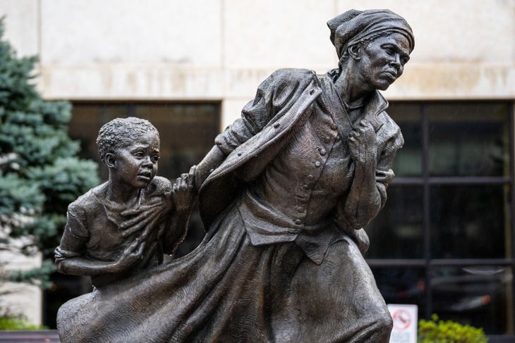 Closeup of Wesley Wofford's 9 ft bronze sculpture, Harriet Tubman — The Journey to Freedom. Depicting Tubman leading a young enslaved girl to freedom