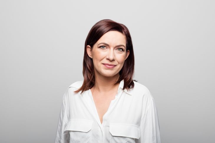 Confident mature businesswoman on white background