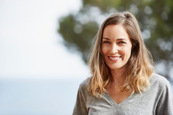Portrait of mature woman smiling outdoors