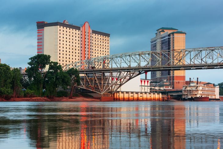 Shreveport, Louisiana, USA downtown skyline on the Red River at twilight.