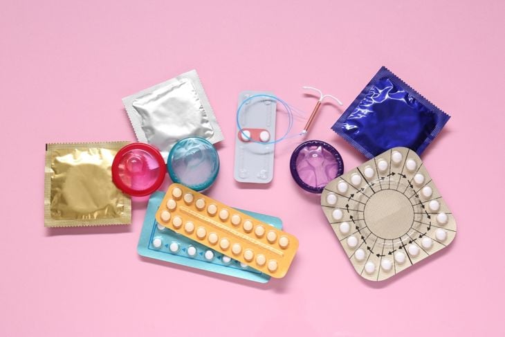 A variety of birth control methods, including pills, condoms, and intrauterine devices, are displayed on a pink background, referencing research into neem’s antifertility potential and its possible role in contraceptive development. 