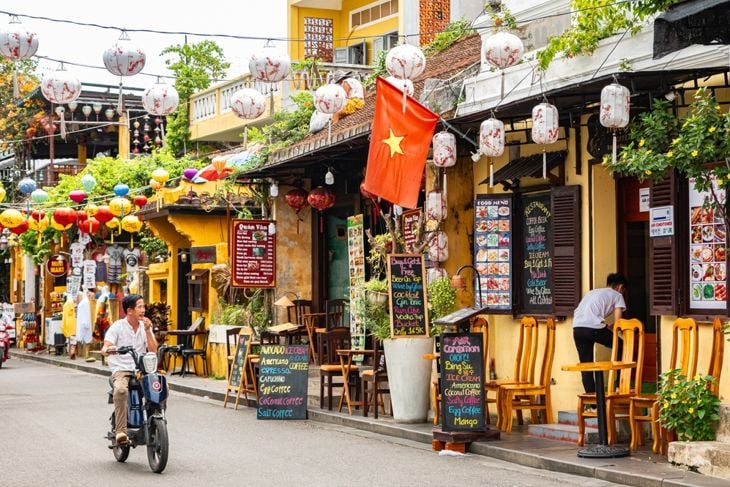 Traditional old yellow houses of Hoi An Ancient Town. Local shops and restaurants in Historic Town of Hoi An Vietnam. Travel photo, selective focus