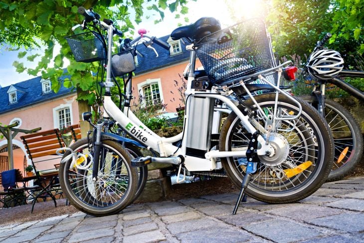 Electric folding bikes in back light