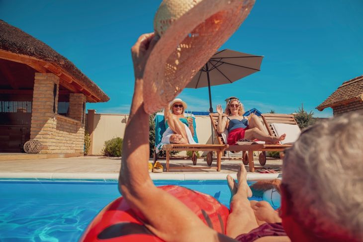 Two senior couples enjoying their summer vacation together