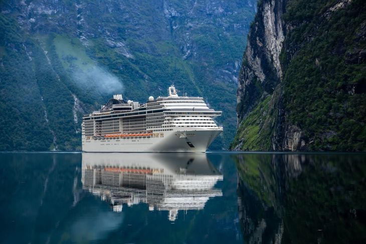 Cruise Ship, Cruise Liners On Geiranger fjord, Norway. The fjord is one of Norway's most visited tourist sites. Geiranger Fjord, a UNESCO World Heritage Site
