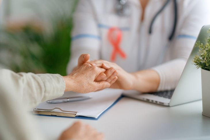 Female patient listening to doctor in medical office.