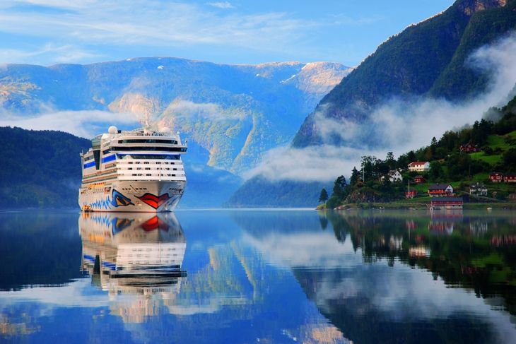 the arrival of a cruise ship in Ulvik, Norway