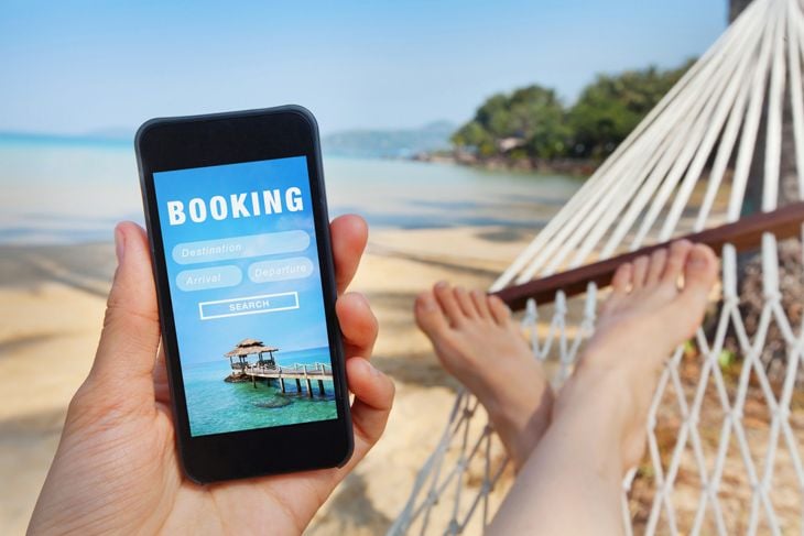 travel booking, hotels and flights reservation on the screen of smartphone