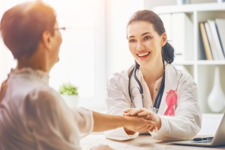 Female patient listening to doctor in medical office