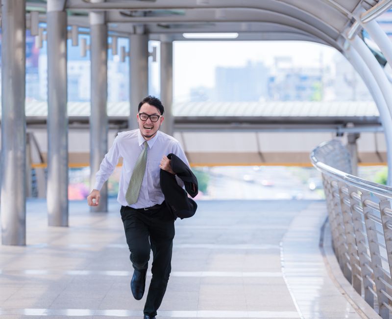Stressed anxious businessman in a hurry and running, he is late for his business appointment and Wear a shirt while running.
