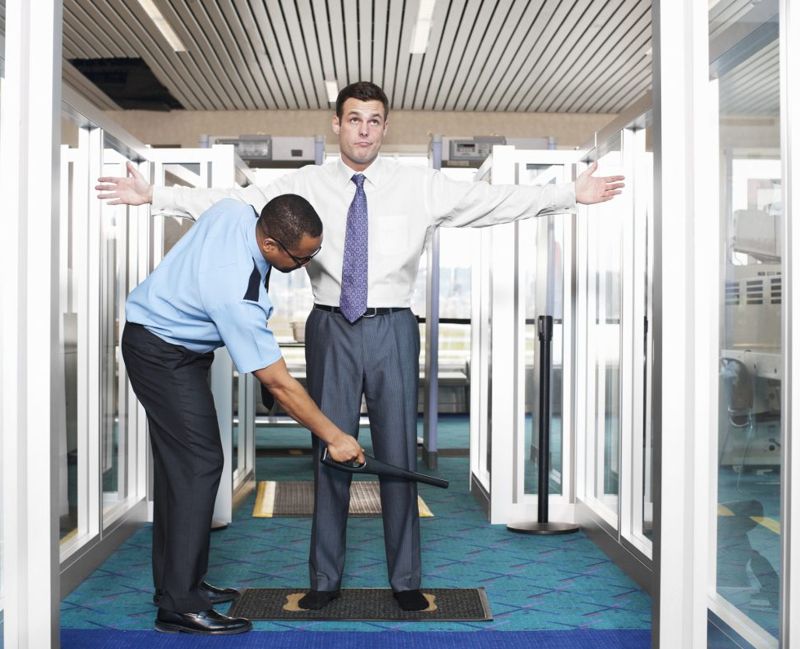 Airport Security Check with Young Businessman