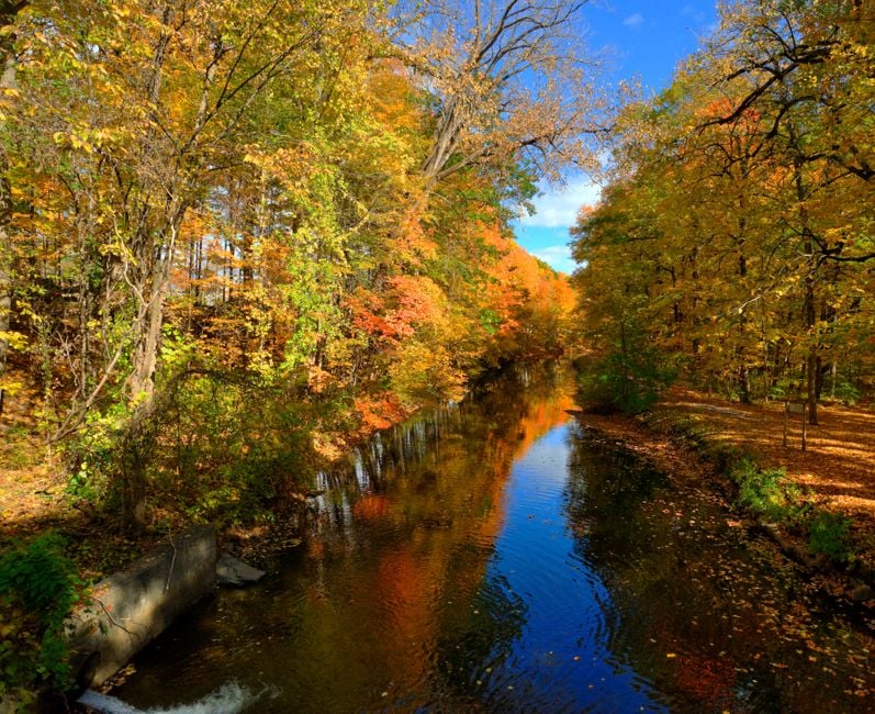 Feeder Canal in Glens Falls, NY with vibrant leaves in autumn