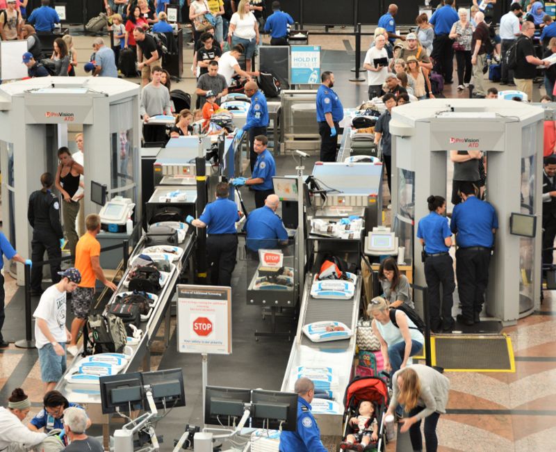 Travelers in long lines at Denver International Airport going thru the Transportation Security Administrations (TSA) security screening areas