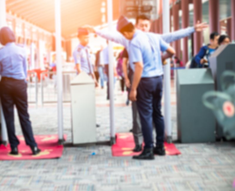 Blurred Airport security check at gates with metal detector and scanner 