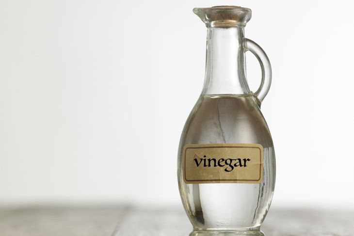white vinegar on the wooden table top